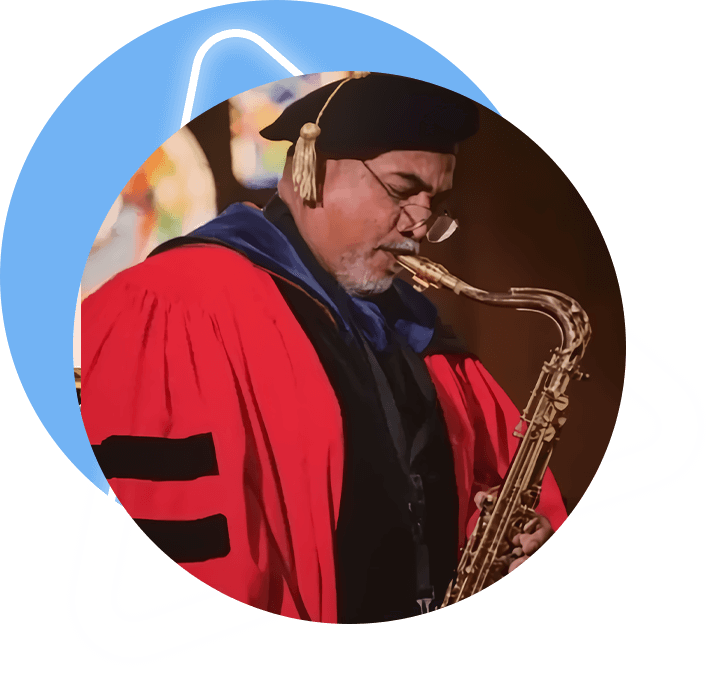 A man in red robe and cap playing saxophone.